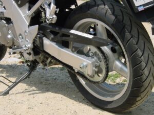 Motorcycle tire on a dirt road.